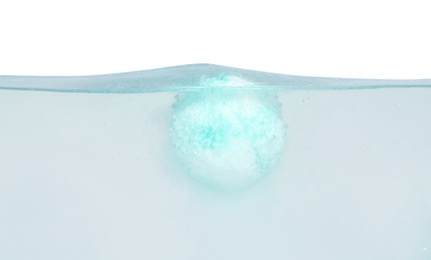 Photo of Bath bomb in water on white background