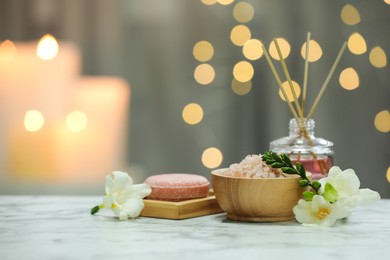 Photo of Beautiful composition with different spa products and rose flower on white marble table. Space for text