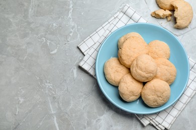 Delicious sugar cookies on light grey marble table, flat lay. Space for text