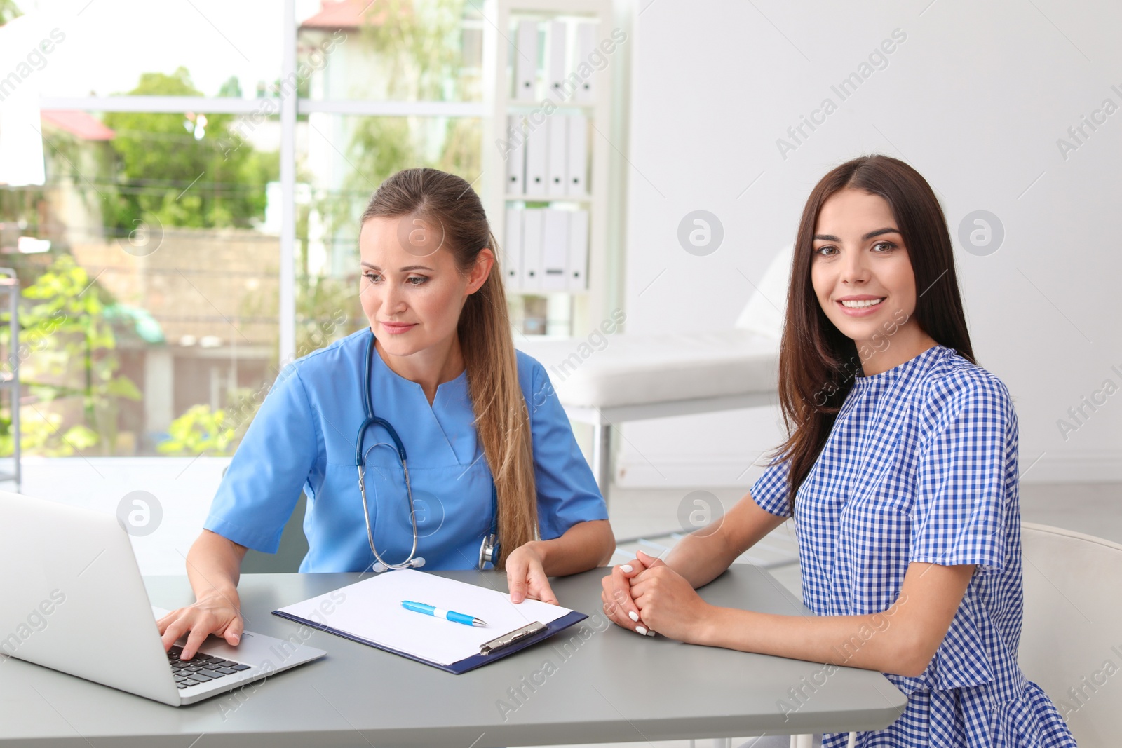 Photo of Patient having appointment with doctor in hospital