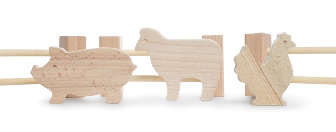 Kit with wooden farm animal figures isolated on white. Educational toy for motor skills development