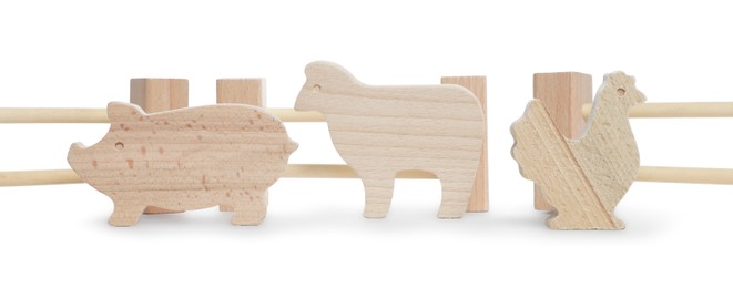 Photo of Kit with wooden farm animal figures isolated on white. Educational toy for motor skills development