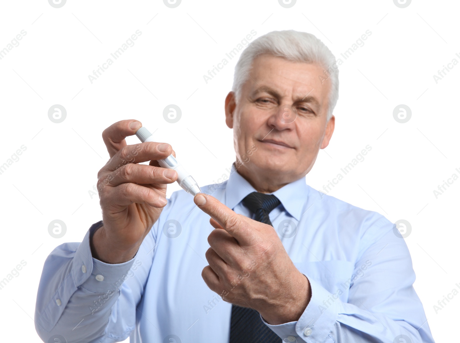 Photo of Senior man using lancet pen on white background. Diabetes control