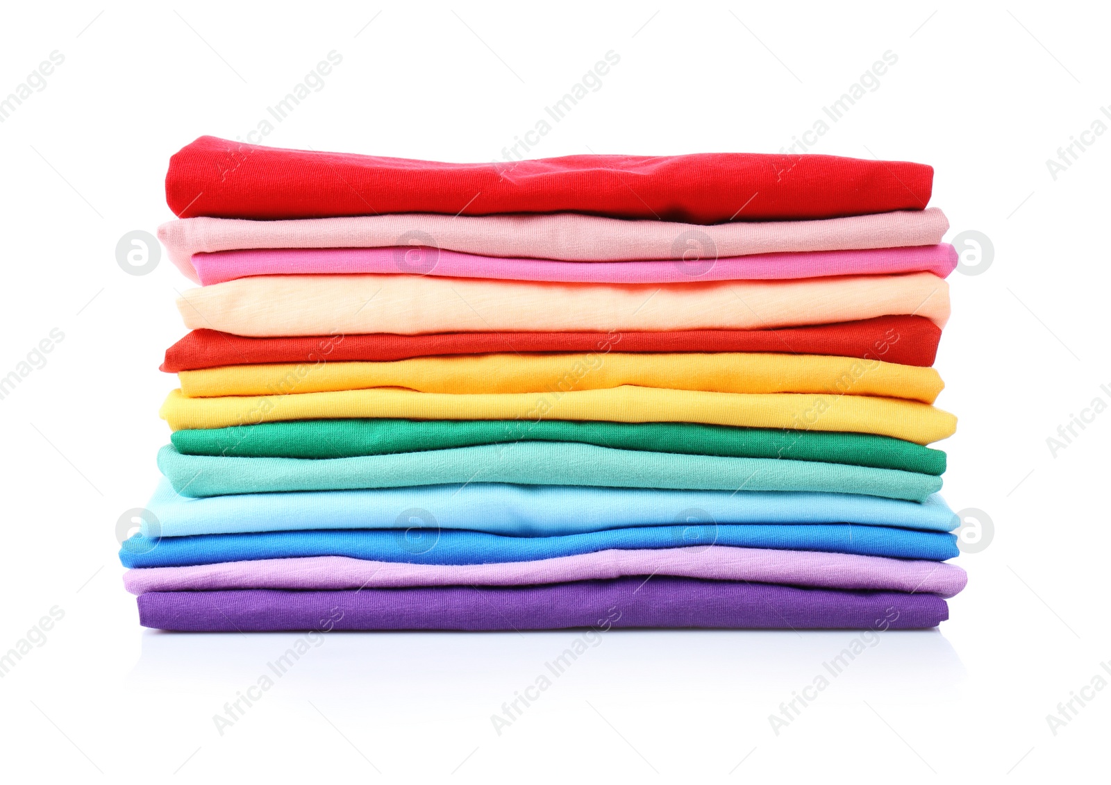 Photo of Stack of colorful t-shirts on white background