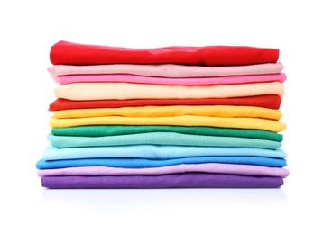 Photo of Stack of colorful t-shirts on white background