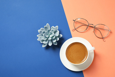 Photo of Flat lay composition with classic black coffee on blue and orange background. Color of the year 2020