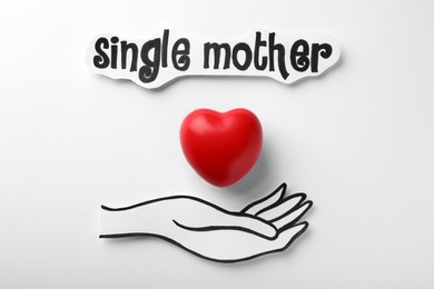 Hand with heart and text Single Mother on white background, flat lay