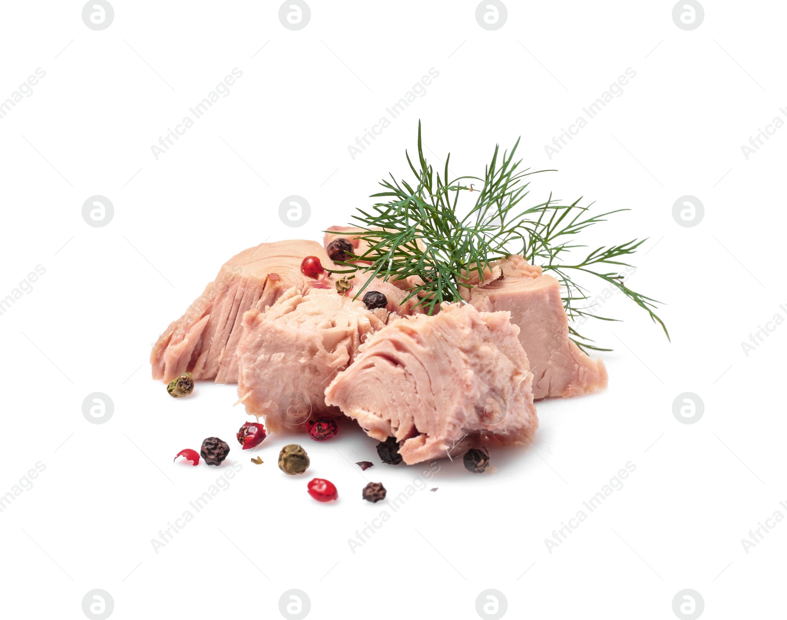 Photo of Pieces of canned tuna with dill and pepper on white background