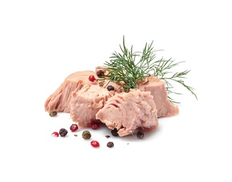 Photo of Pieces of canned tuna with dill and pepper on white background