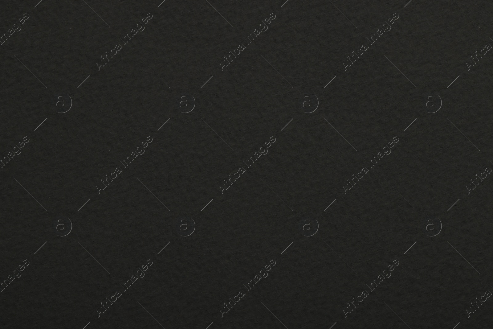 Photo of Texture of dark grey paper sheet as background, top view