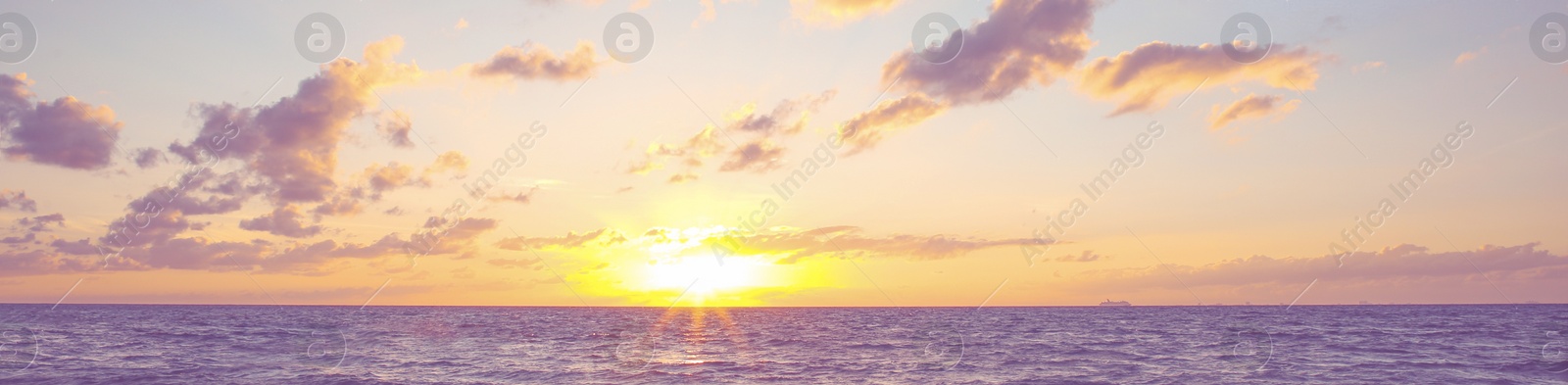 Image of Beautiful panorama of sky with clouds over sea at sunset. Banner design