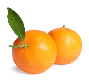 Photo of Fresh ripe juicy tangerines with green leaf isolated on white