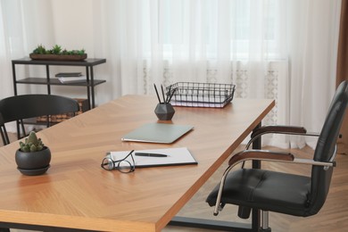 Photo of Modern doctor's workplace in stylish office. Interior design