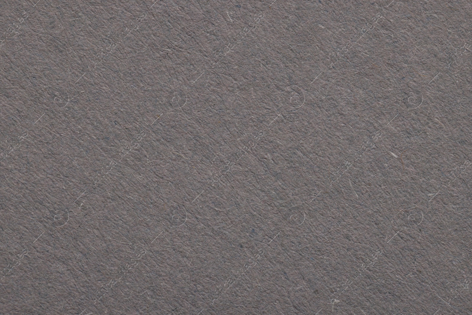 Photo of Texture of grey paper sheet as background, top view