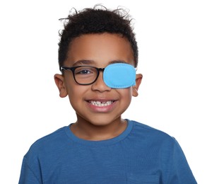 African American boy with eye patch on glasses against white background. Strabismus treatment