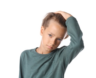 Photo of Portrait of cute little boy in casual outfit on white background