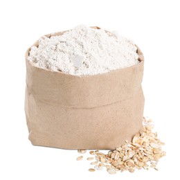 Photo of Paper bag with oatmeal flour and flakes isolated on white