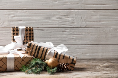 Beautiful composition with gift box and Christmas decorations on wooden table