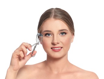 Photo of Young woman with eyelash curler on white background