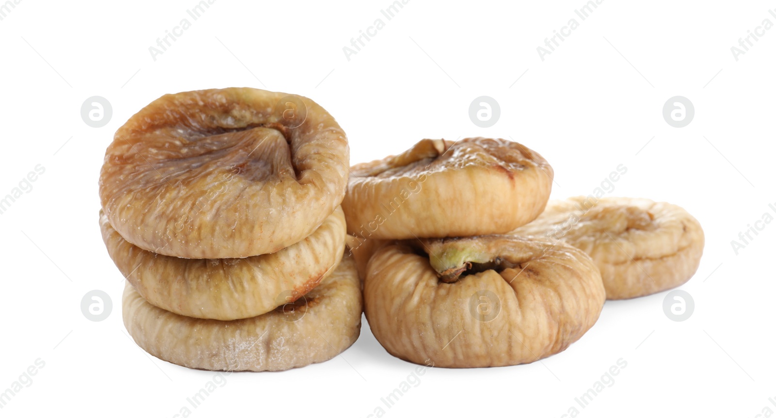 Photo of Pile of tasty dried figs isolated on white