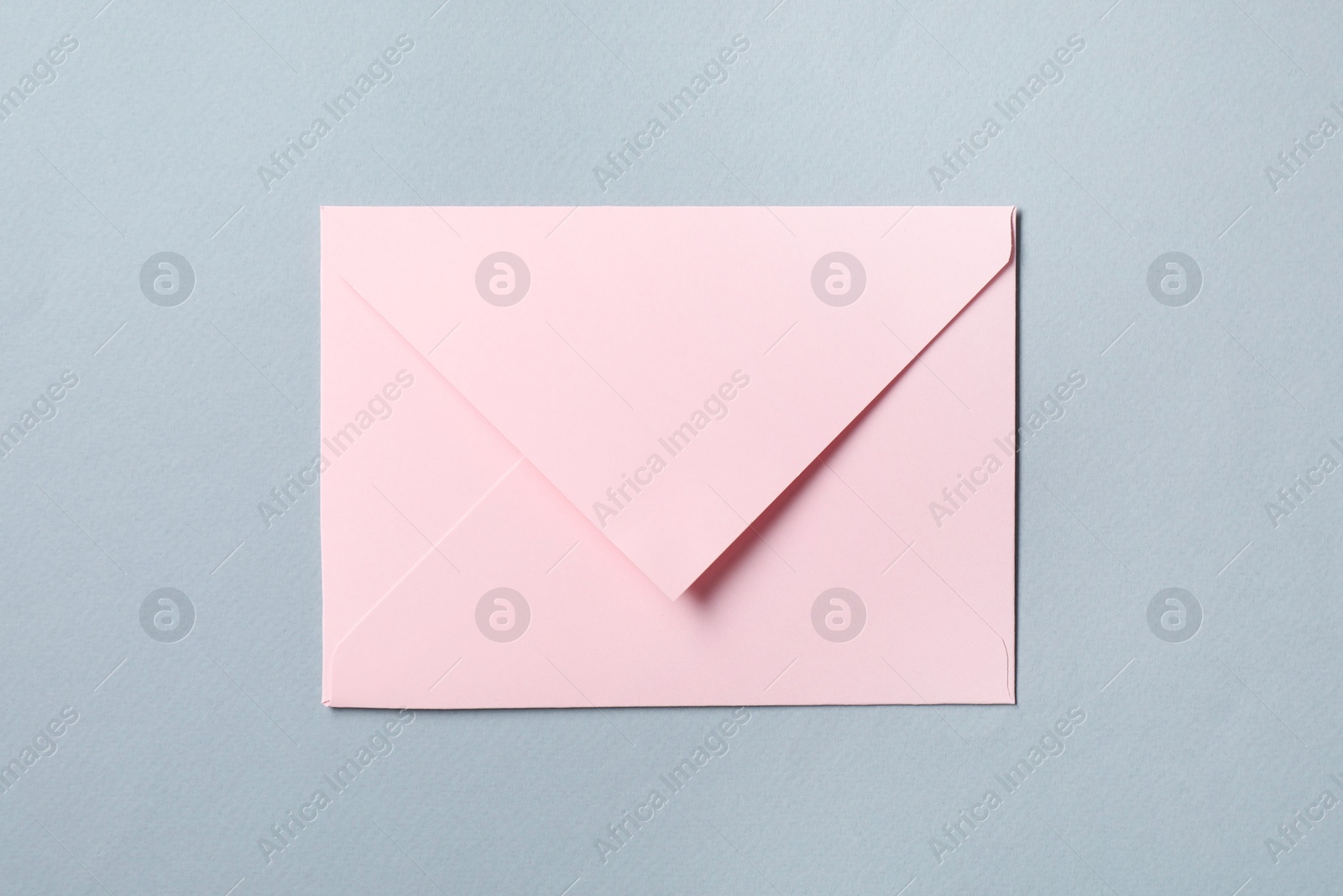 Photo of Letter envelope on grey background, top view