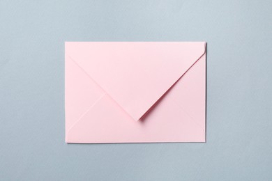 Photo of Letter envelope on grey background, top view