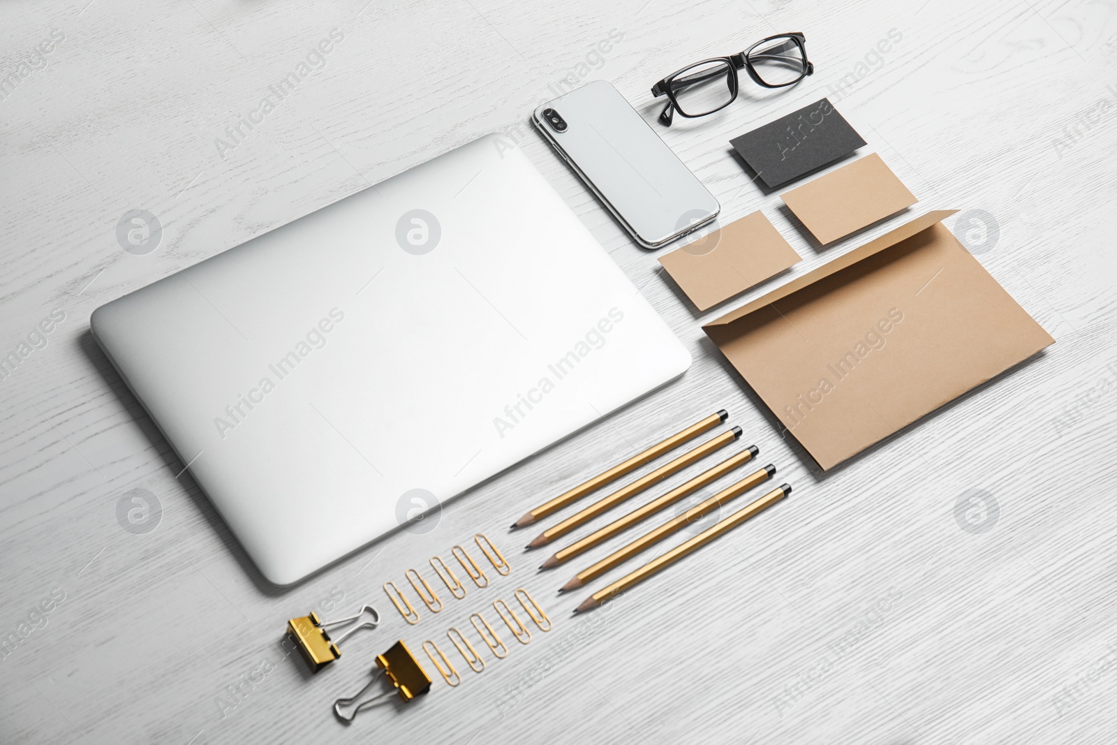 Photo of Composition with stationery on white wooden background. Mock up for design