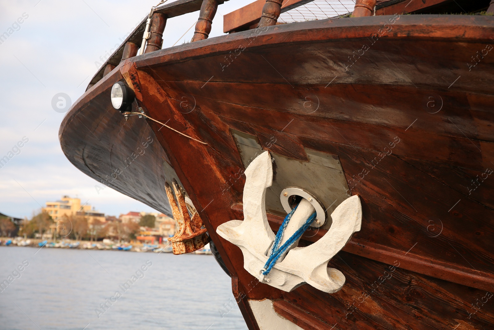 Photo of Huge and massive anchor of modern yacht near sea