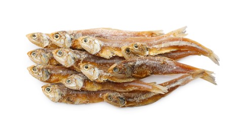 Photo of Delicious dried salted anchovies on white background, top view