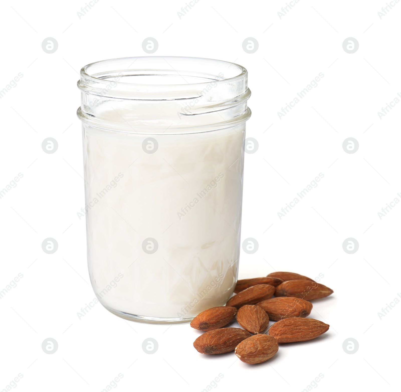 Photo of Jar with almond milk and nuts on white background