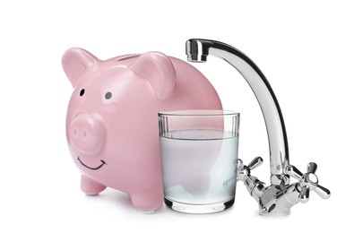 Image of Water scarcity concept. Piggy bank, tap and glass on white background