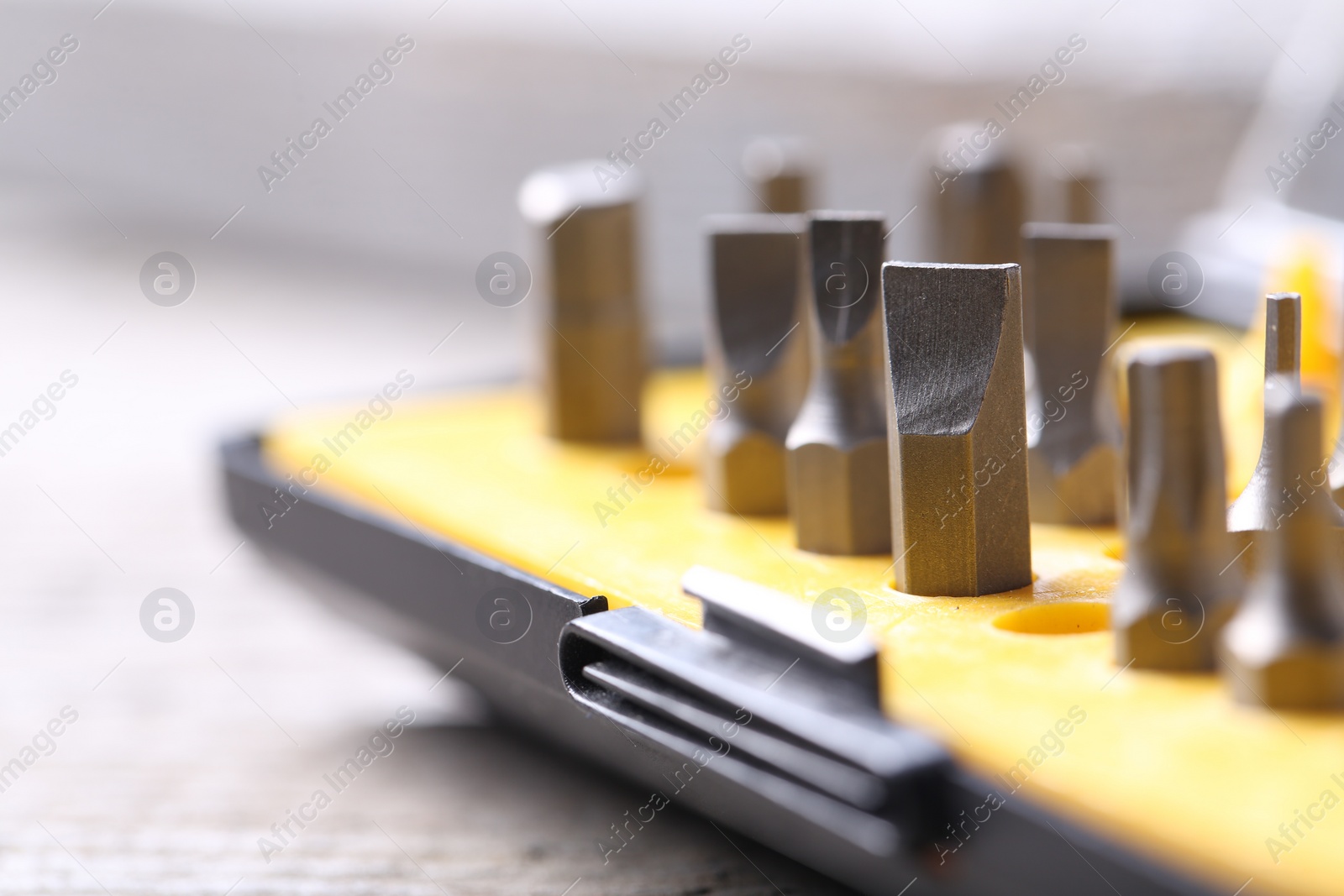 Photo of Screwdriver bit set on blurred background, closeup