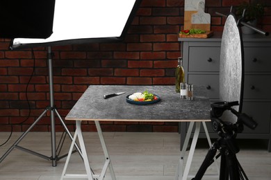 Photo of Composition with mozzarella salad on black table in professional photo studio. Food photography