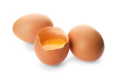 Raw brown chicken eggs on white background