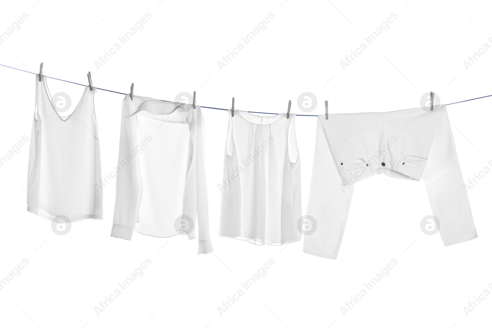 Photo of Different clothes drying on laundry line against white background
