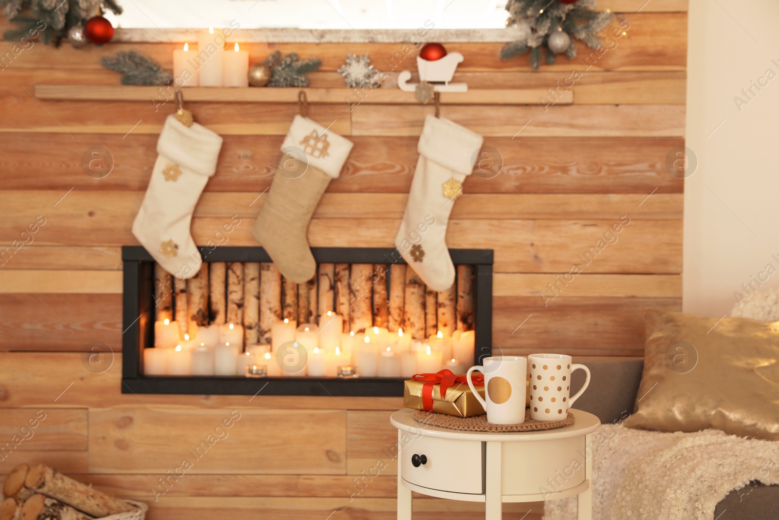 Photo of Beautiful Christmas interior of living room with decorative fireplace