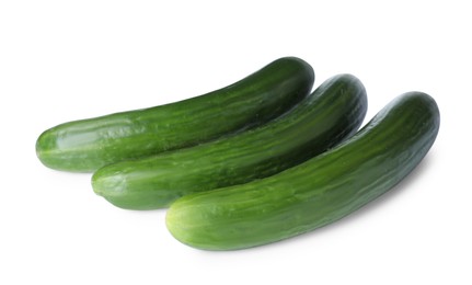Photo of Whole fresh green cucumbers isolated on white