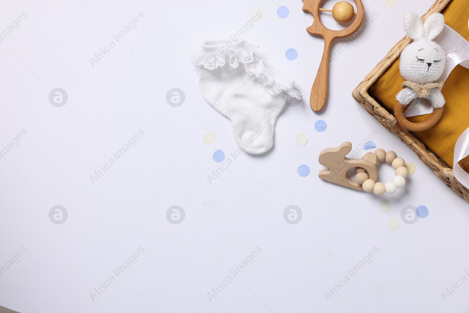 Photo of Flat lay composition with different baby accessories on white background. Space for text