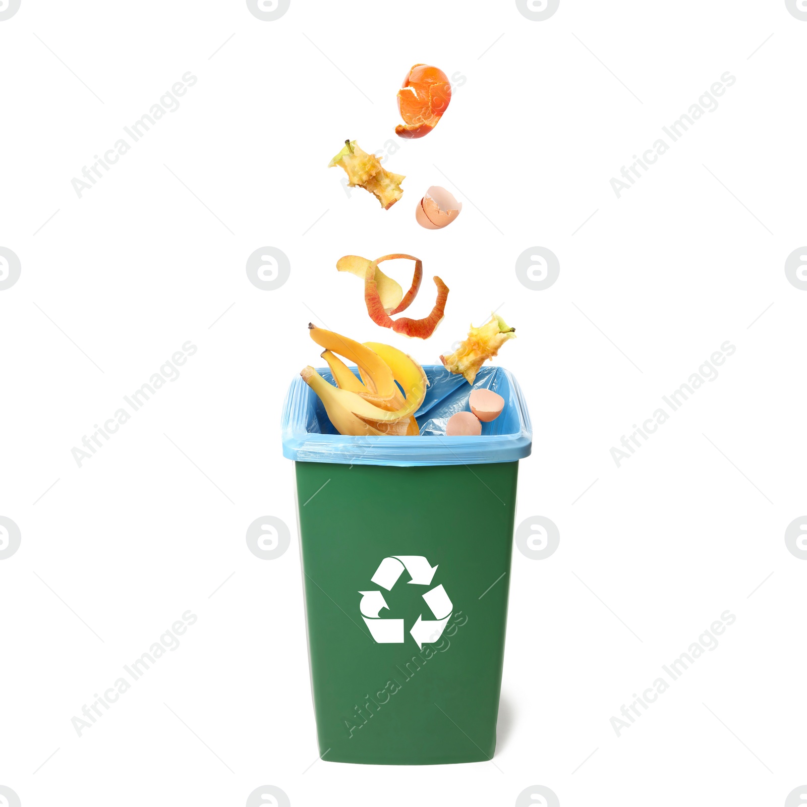 Image of Garbage falling into trash bin on white background