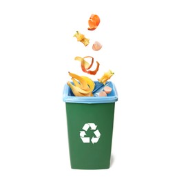 Image of Garbage falling into trash bin on white background