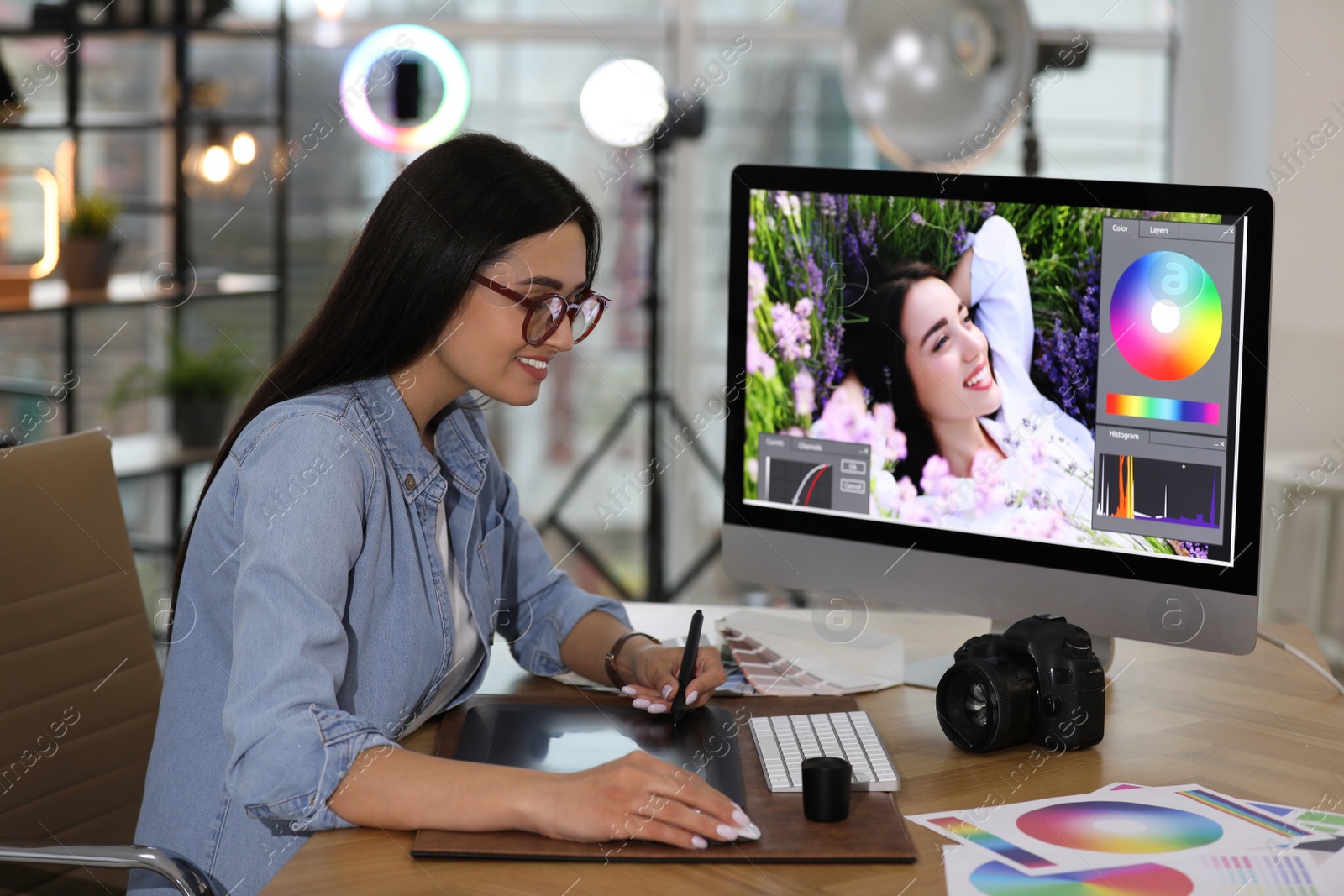 Photo of Professional retoucher working on computer in office