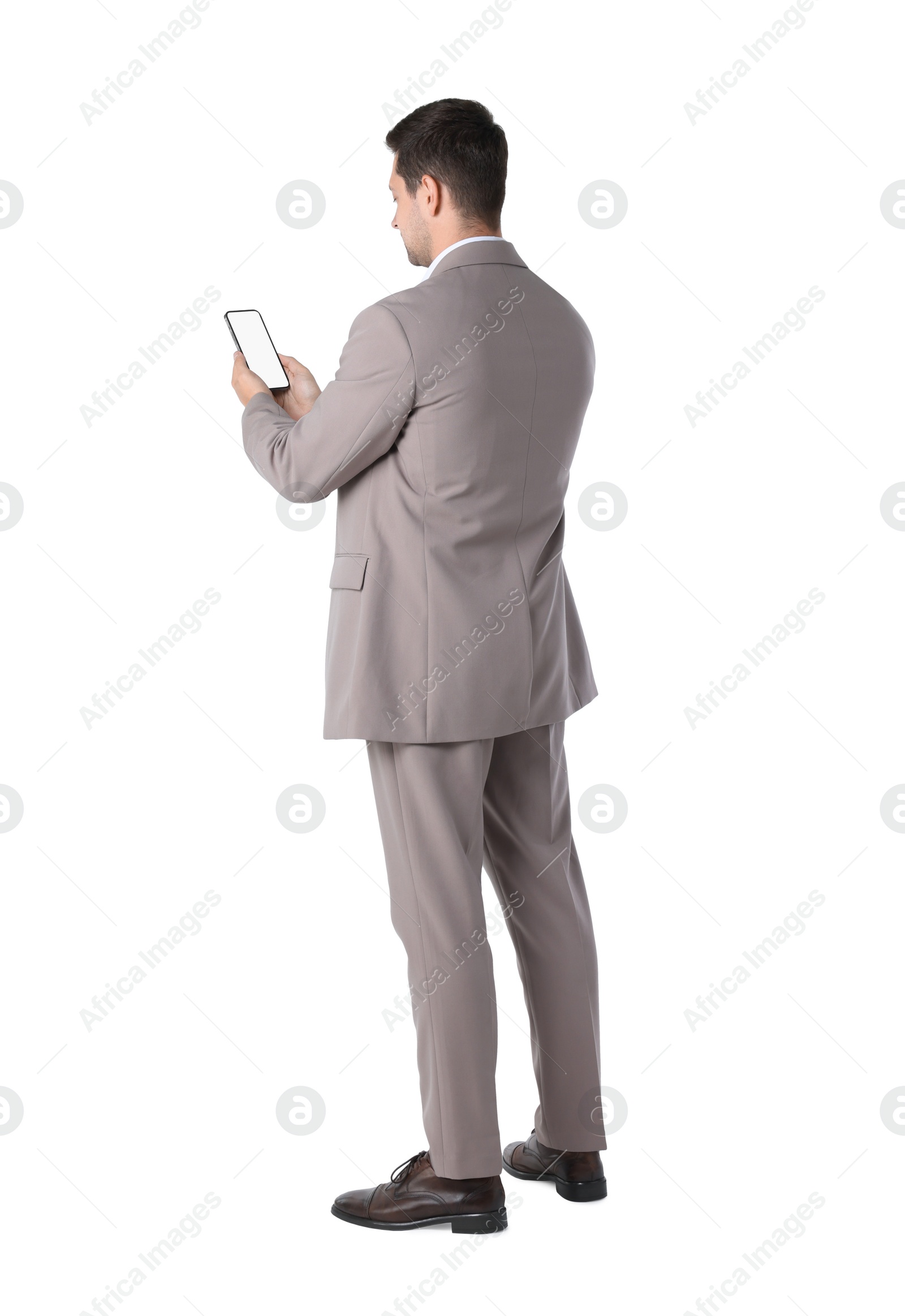 Photo of Man holding smartphone with blank screen on white background