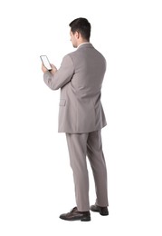 Man holding smartphone with blank screen on white background