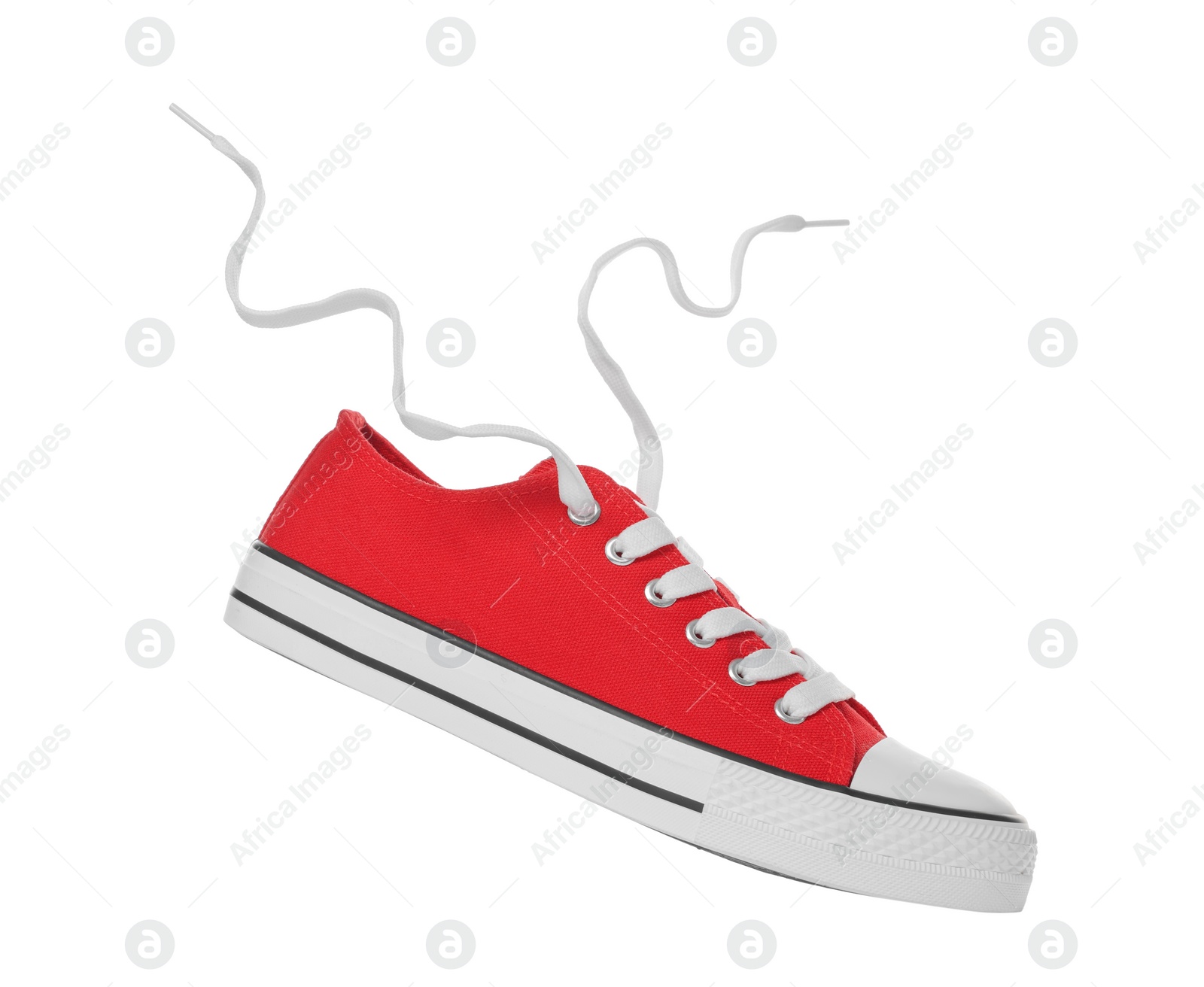 Photo of Red classic old school sneaker isolated on white