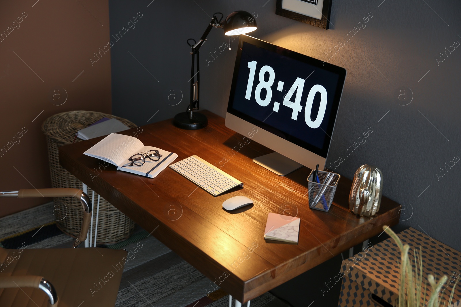 Photo of Comfortable workplace with computer on desk in home office