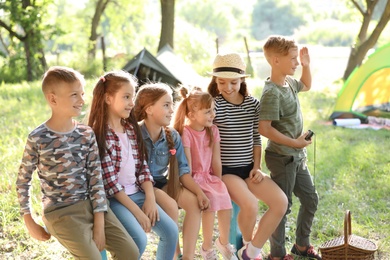 Little children outdoors on sunny day. Summer camp