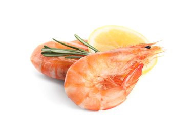 Photo of Delicious cooked shrimps, lemon and rosemary isolated on white