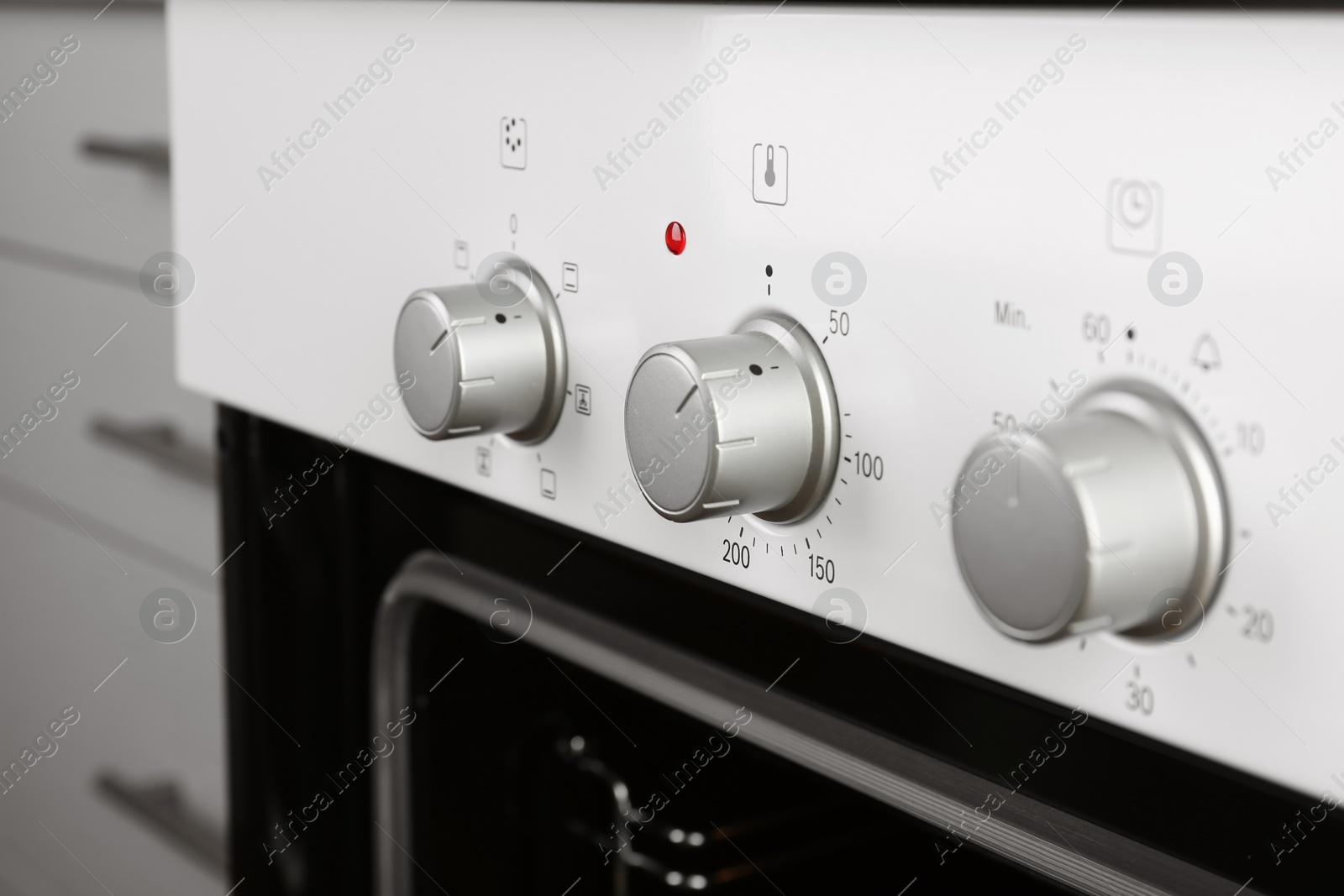 Photo of Open empty electric oven in kitchen, closeup