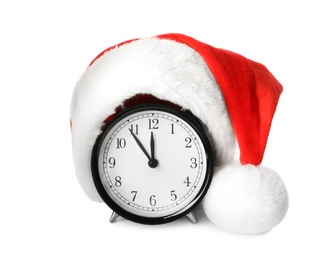 Alarm clock with Santa hat on white background. New Year countdown