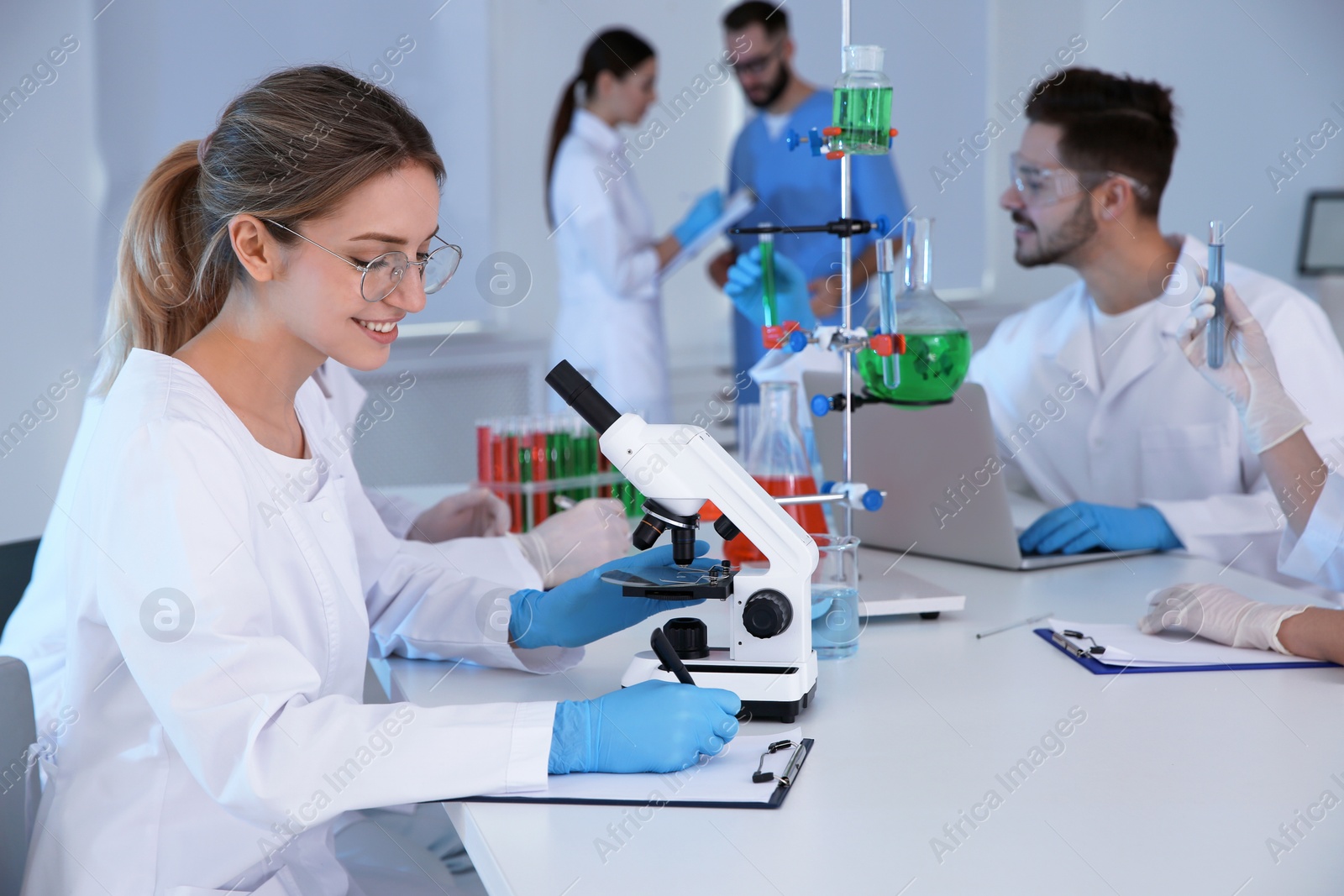 Photo of Medical students working in modern scientific laboratory